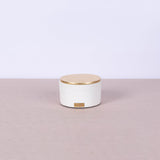 Small white round concrete box with gold leaf lid - Fastoun
