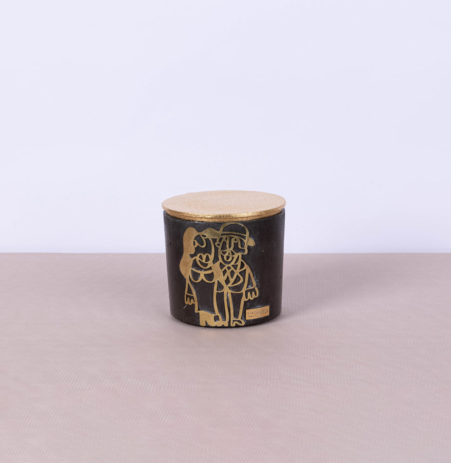 Large round black concrete box with graffiti in copper and gold leaf lid - Fastoun