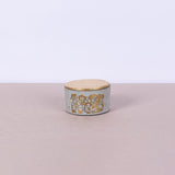 Small round concrete box with graffiti in copper and gold leaf lid - Fastoun