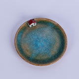 Round handmade flat plate with a house - Fastoun